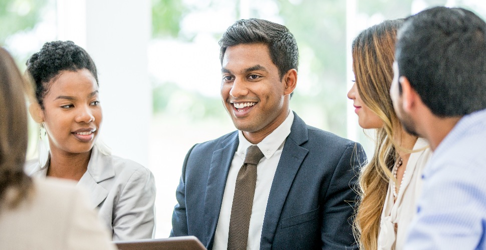 employees-smiling-in-a-group