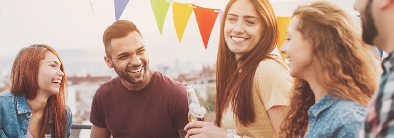 A group of young people socialising outside of work as a way of networking.