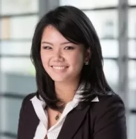 A smiling professional in formal attire