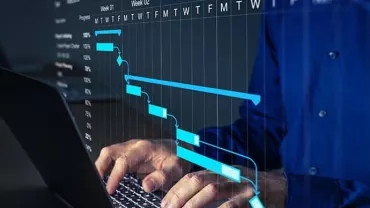 Person working on a laptop with a Gantt chart overlay.
