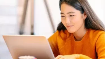 A person is working on a laptop.