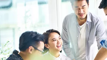 Group collaborating in a bright office setting.