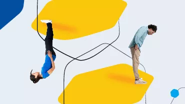 Two people on a colorful abstract background, one upside down