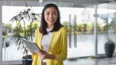 A professional smiles showing confidence in asking for a pay rise