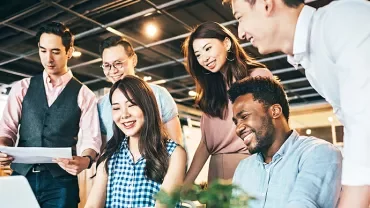 A group of people working together in an office.