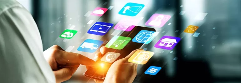 Person using a smartphone with app icons displayed.