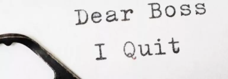Text on paper reads 'Dear Boss, I Quit'.