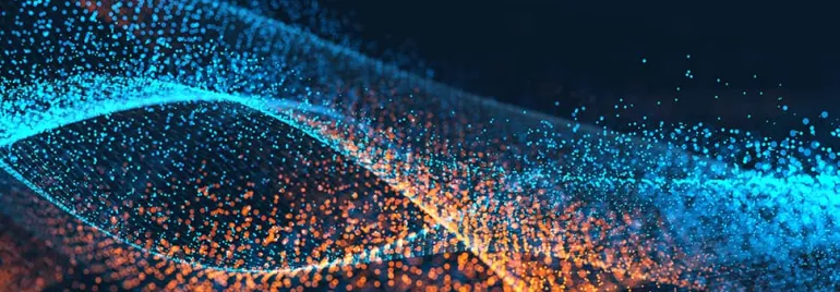Blue and orange particles forming an interwoven wave pattern.