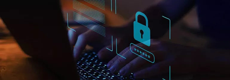 Hands typing on a keyboard with a padlock icon, symbolizing cybersecurity.