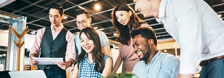 A group of people working together in an office.