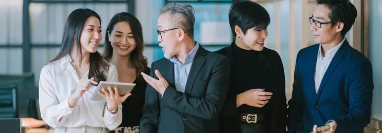 A group of business professionals having a cheerful discussion.