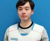 Person wearing a Decathlon vest against a blue background