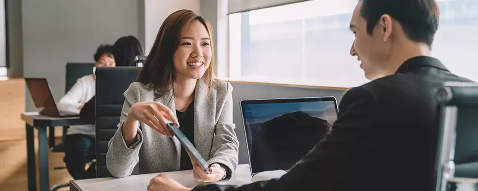 Two people having a meeting in an office setting