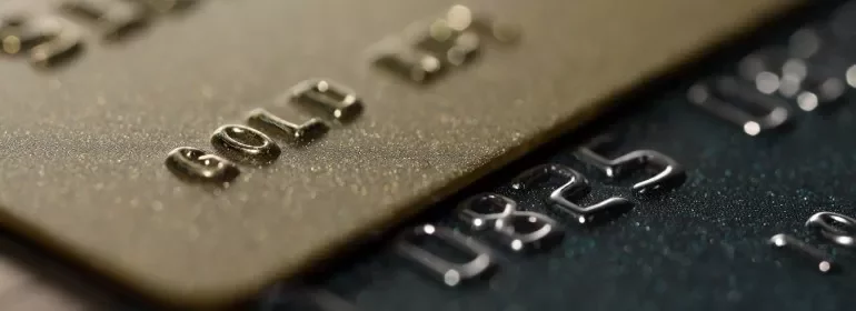  Multiple credit cards arranged side by side, highlighting their unique patterns and branding.