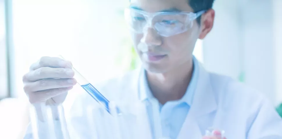Scientist holding a test tube in a laboratory